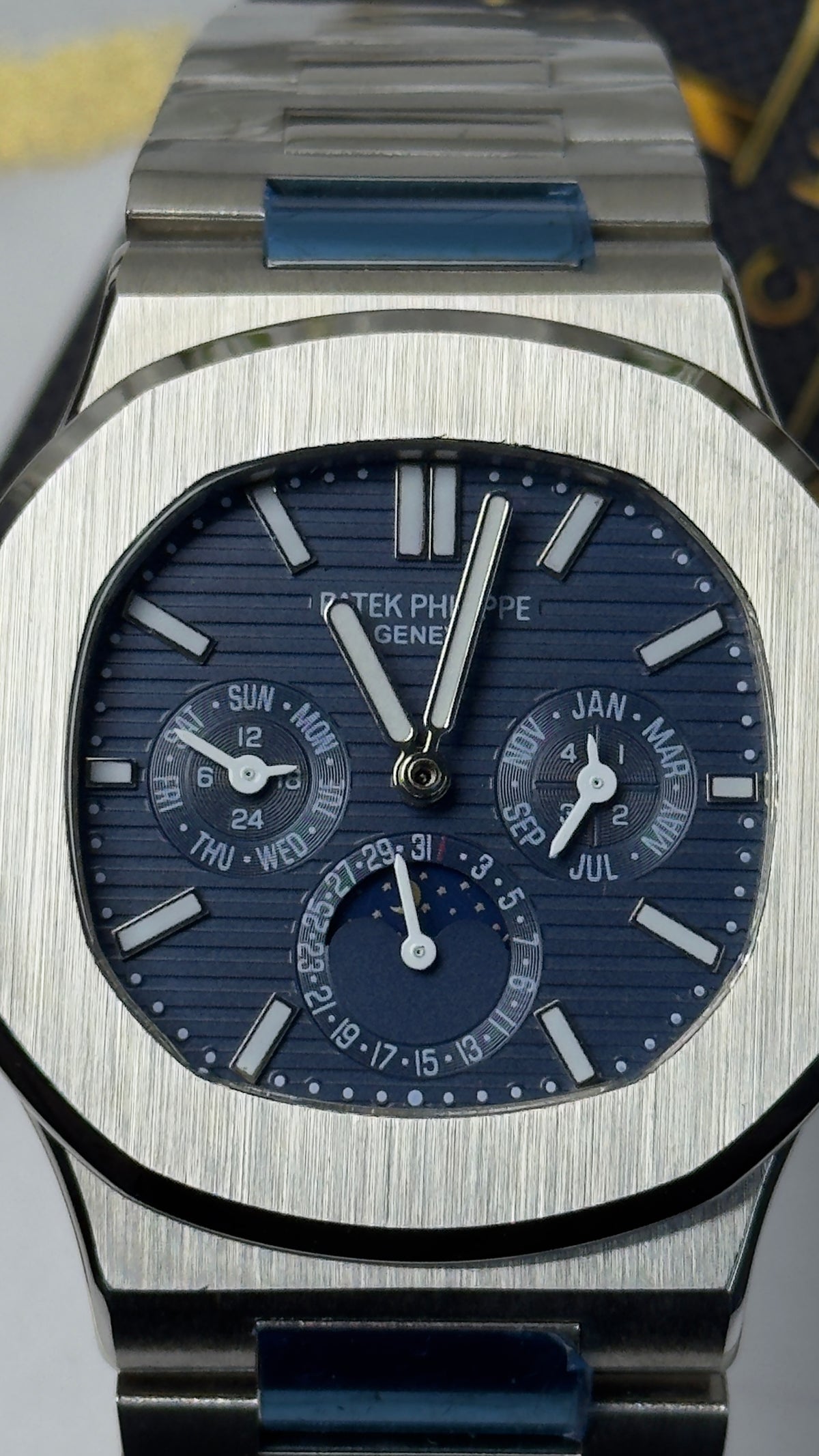 Patek Philippe Nautilus Perpetual Calendar - sunburst blue horizontally embossed dial
