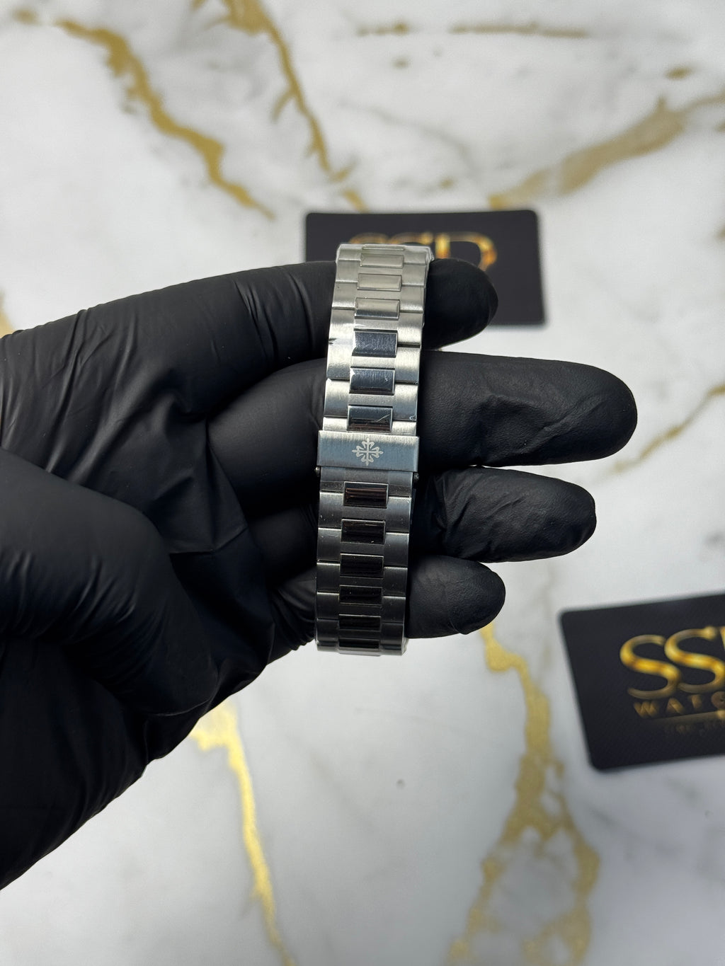 Patek Philippe Nautilus Perpetual Calendar - sunburst blue horizontally embossed dial