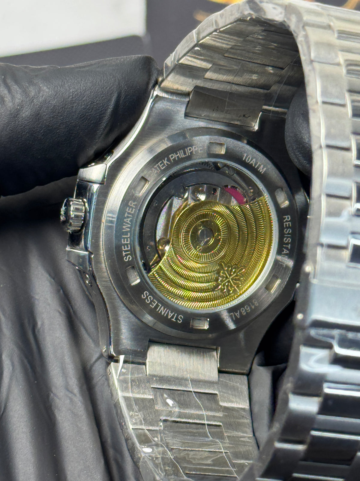 Patek Philippe Nautilus Perpetual Calendar - sunburst blue horizontally embossed dial